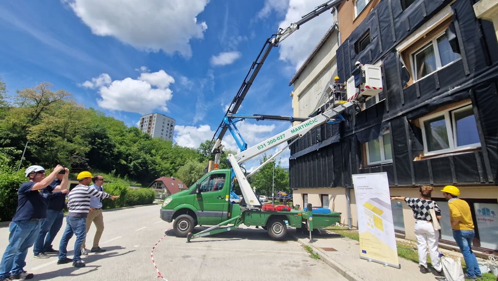 Figure 2. Installing timber-based façades at the Slovenian demo-case. Credits: INFINITE.