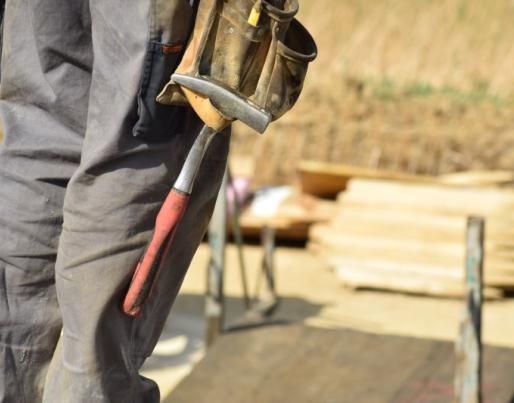 Construction worker with tools on site