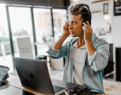person headphones laptop indoor quality