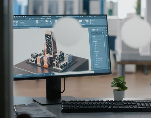 3D representation of a building on an office desk