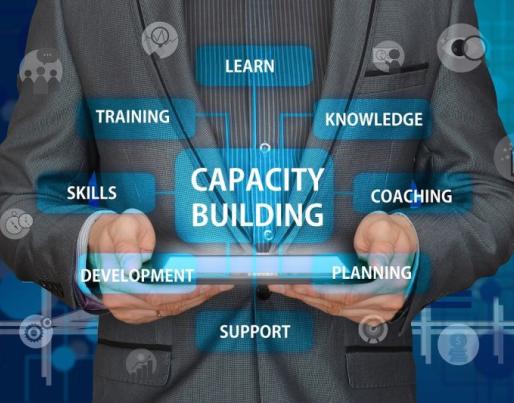 Business man holding a tablet for capacity building skills