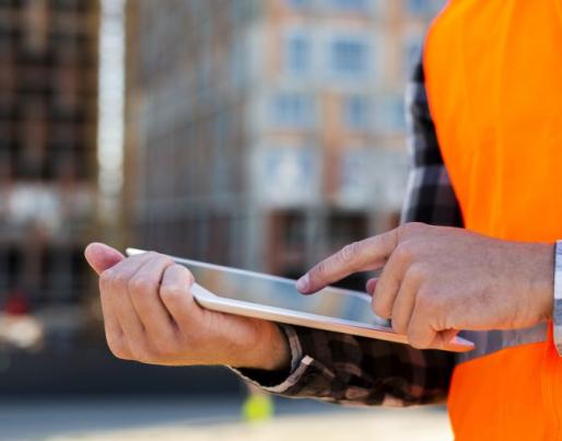 Construction worker with a tablet