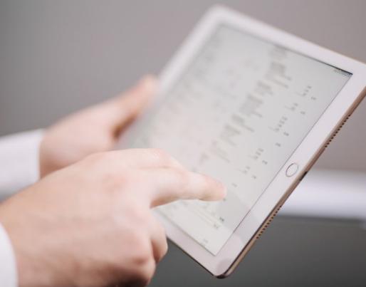 Unrecognisable office worker with tablet