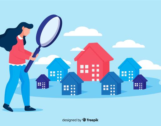 Woman looking at houses with magnifying glass