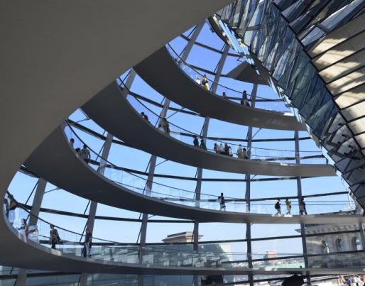 Inside of a glass building with people