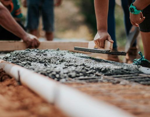 Workers laying concrete