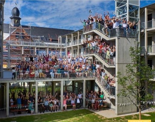 picture with people smiling and laughing on stairs