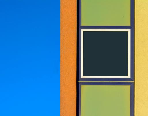 A coloured facade against the blue sky