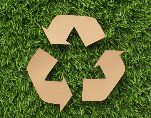 Recycle sign on the grass