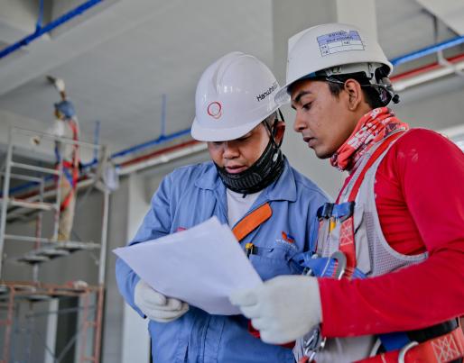 Construction workers reading a document