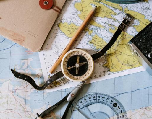 A compass and maps