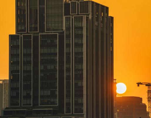 A tall building at sunset