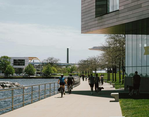 People biking near a building