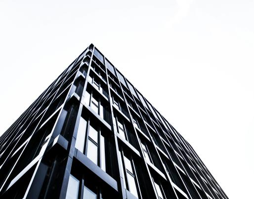 Low angle shot of a black metal and glass building