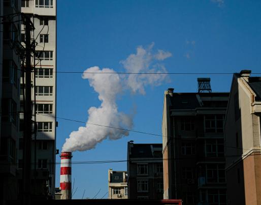 Image of buildings and a chimeney smoking