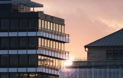 two buildings at sunset