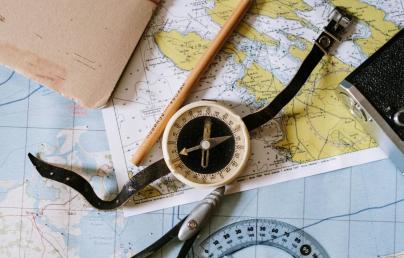 A compass and maps