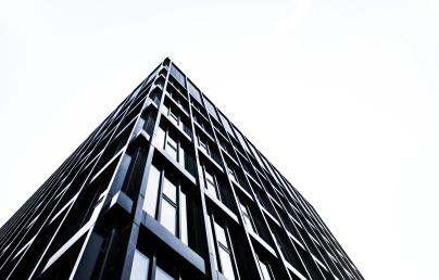 Low angle shot of a black metal and glass building