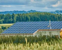 Solar panels on the roof of a building in the countryside