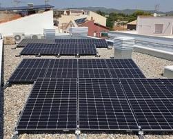 Solar photovoltaic panels on the roof of the building