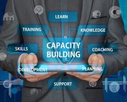 Business man holding a tablet for capacity building skills