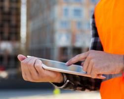 Construction worker with a tablet