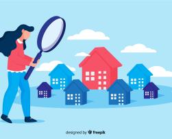 Woman looking at houses with magnifying glass