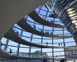 Inside of a glass building with people
