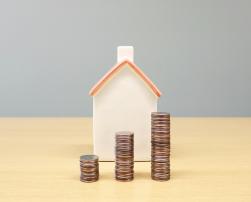 A model house and coins