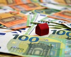 Wood house toy on money