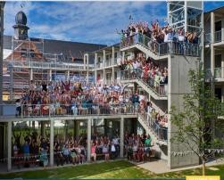 picture with people smiling and laughing on stairs