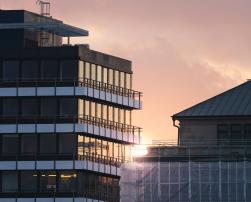 two buildings at sunset