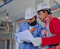 Construction workers reading a document