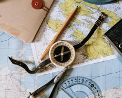 A compass and maps