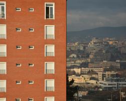 A view of Pristine with a tall building in the foreground
