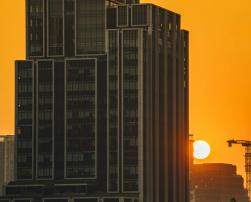 A tall building at sunset