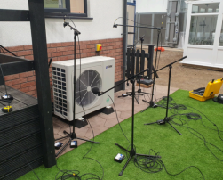 Microphones recording the noises from a heat pump