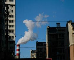 Image of buildings and a chimeney smoking